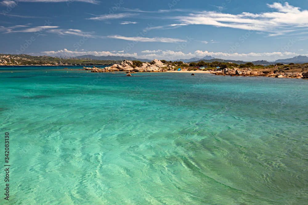 Panoramic view of the sunny beaches, and of the clear and transparent waters of the Maddalena island in Sardinia, Italy.