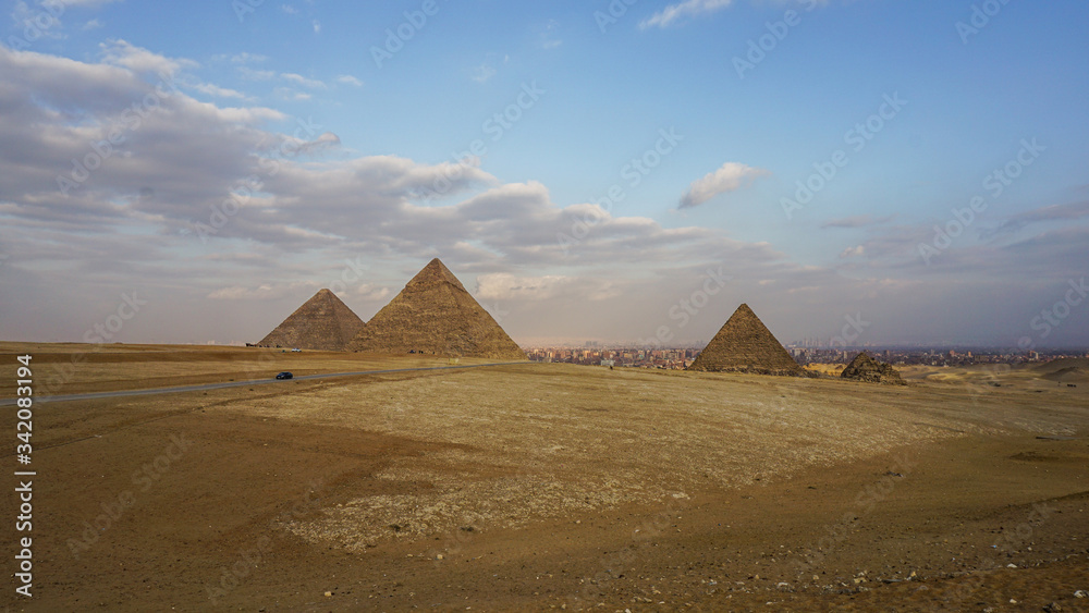 Pyramids of Giza with Giza city view background