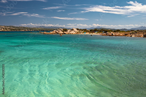 Panoramic view of the sunny beaches, and of the clear and transparent waters of the Maddalena island in Sardinia, Italy. © serghi8