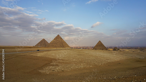 Pyramids of Giza with Giza city view background