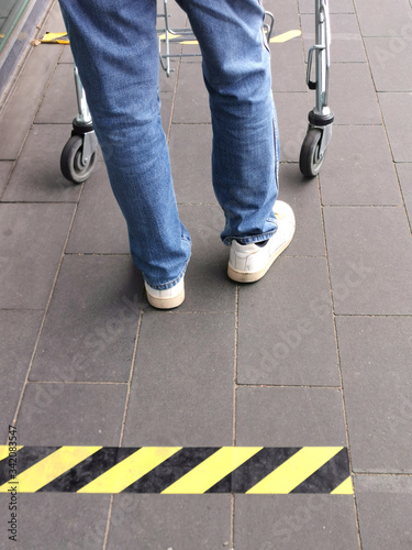Line to the store with lines for the distance, keep your distance in quarantine,