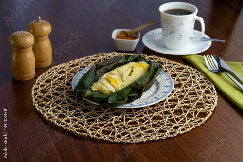 Potato tamales served with coffee and chili sauce