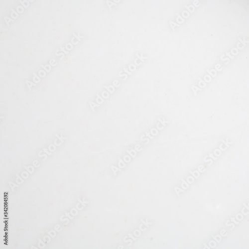 White blurred background with small snowflakes © alexanderkonsta