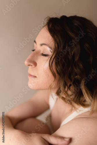 Young woman with piercing on her brows calm