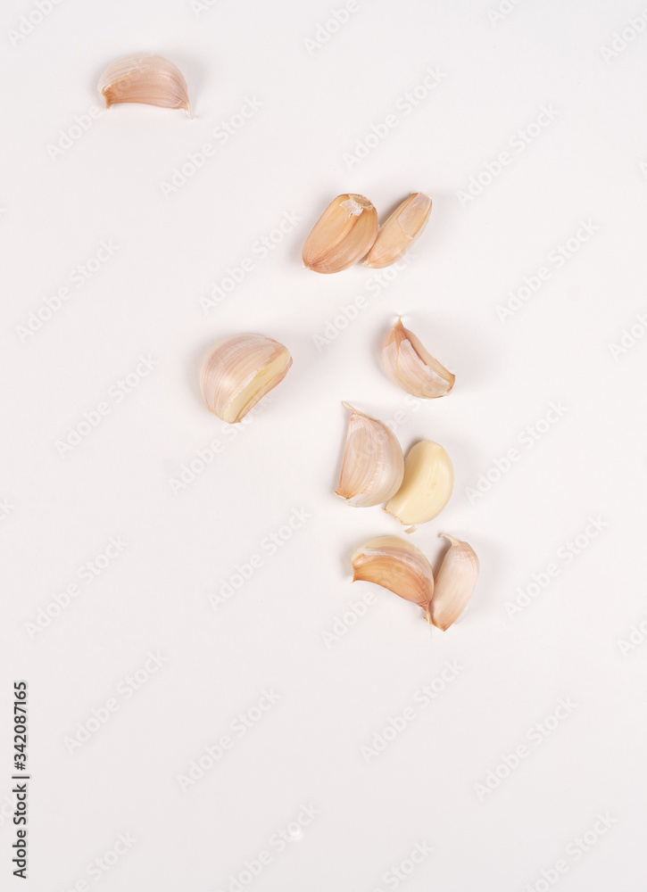 garlic lies on a white table. white background garlic lies on a white table. white background