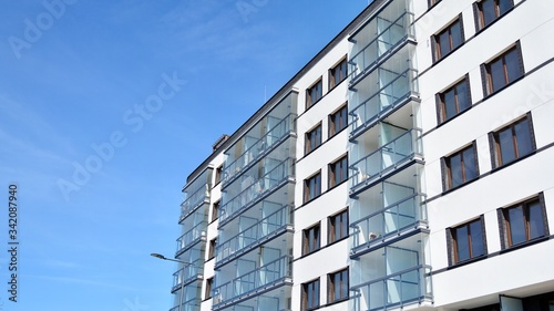 Modern condo building with big windows and modern facade.