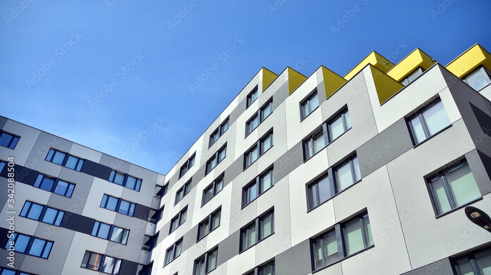 Modern condo building with big windows and modern facade.