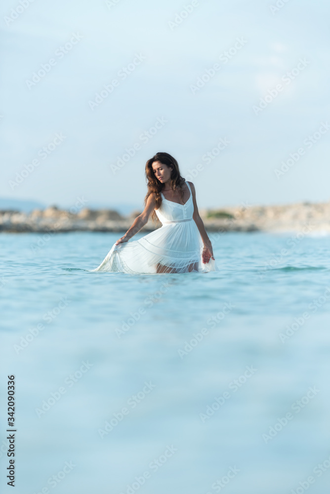 Happy woman dancing in sea water Happy woman dancing in sea water