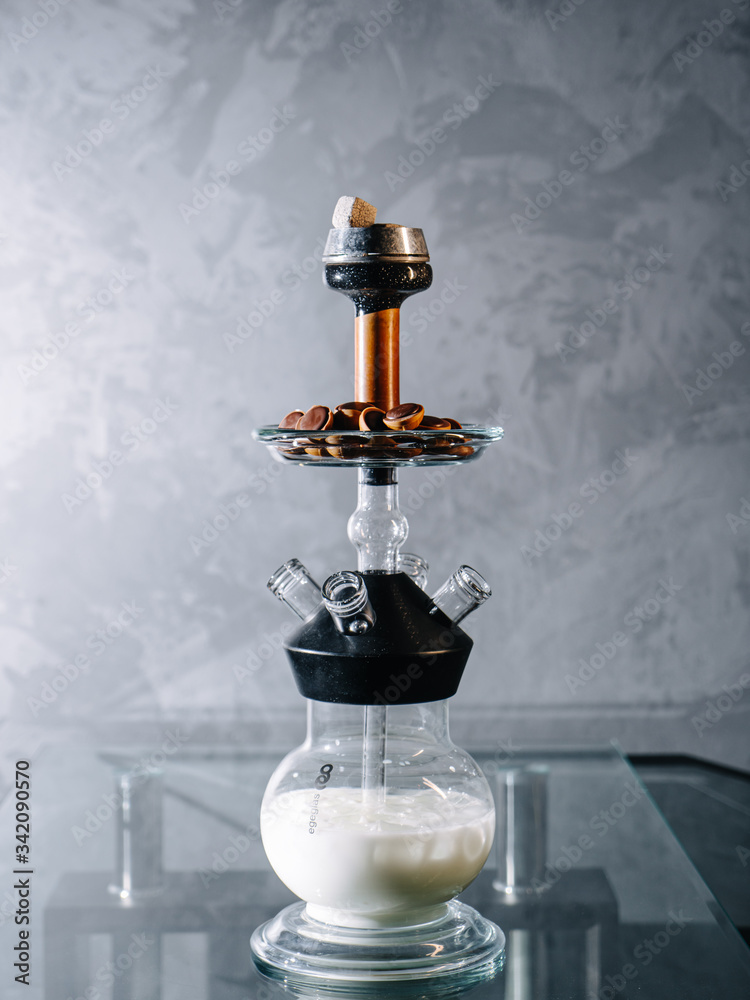 Milk based shisha with sweet tobacco and chocolate fudge in a vase as a  snack Photos | Adobe Stock