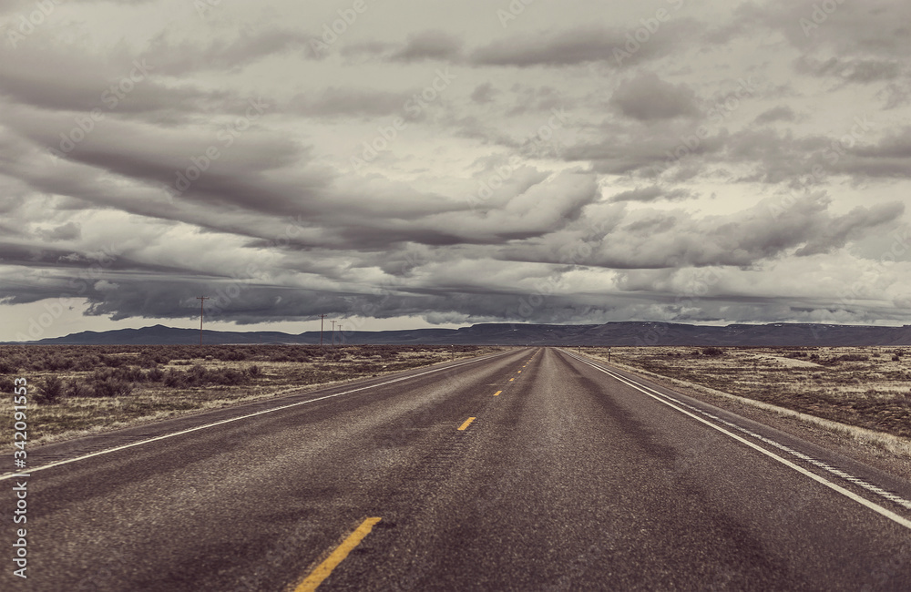 A Lonely Long Road with a Stunning Scenic Landscape View A Lonely Long Road with a Stunning Scenic Landscape View