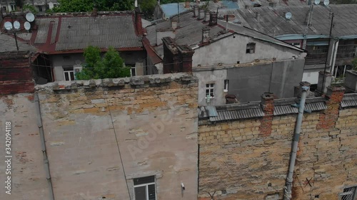 Ukraine, Odessa top view on old brick and concrete Soviet-built houses in the spring on a sunny day, vertical flight