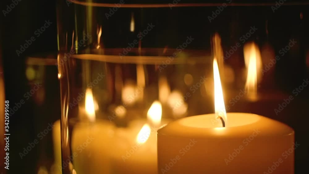 Few candles glowing in the dark