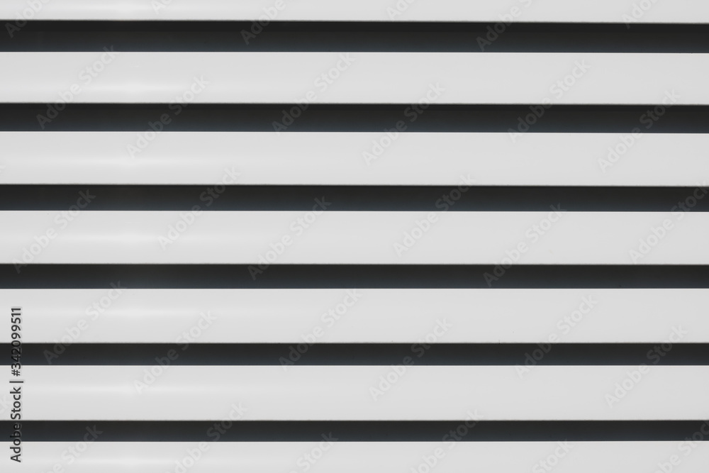 some white slats of a blind form a background