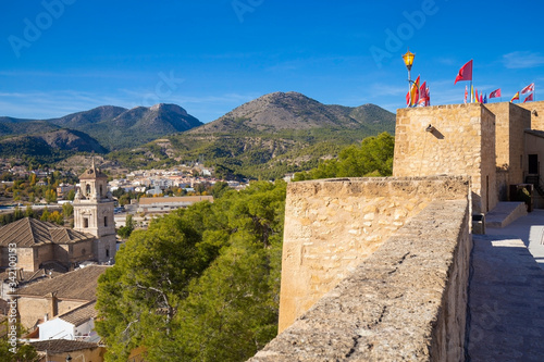 Panorama of the city of Caravaca de la Cruz and part of the stone wall of the fortress, a place of pilgrimage near Murcia in Spain photo