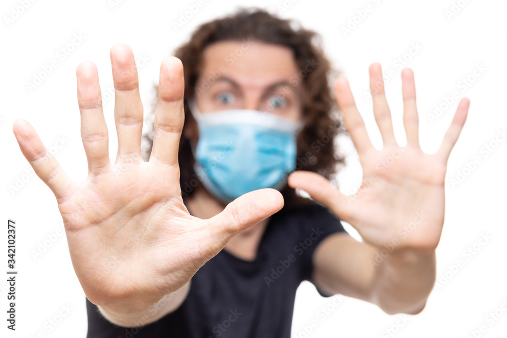 Emotional guy in medical mask. Pandemic coronavirus epidemic covid-19 quarantine isolated white Emotional guy in medical mask. Pandemic coronavirus epidemic covid-19 quarantine isolated white