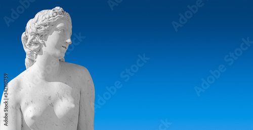 Banner with old statue of sensual renaissance era woman at blue smooth gradient background with copy space, Potsdam, Germany, details, closeup