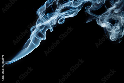 Beautiful colorful/blue smoke on black background. Movement of abstract smoke on dark background