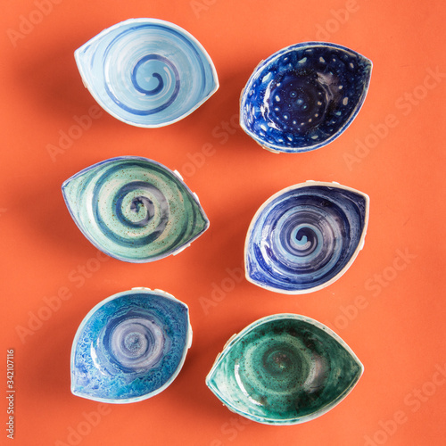 colorful ceramic bowls on wooden table