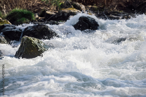 Running mountain river. Abstract shapes made of water.