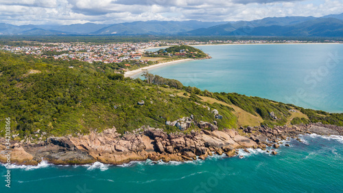 Aerial view of Cima beach, in Palhoça. Beautiful beach among green mountains in Santa Catarina, Brazil