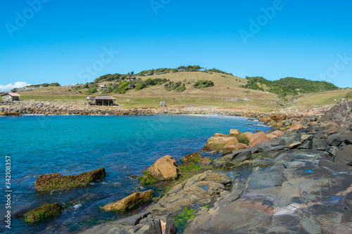 Maço beach, in Palhoça. Beautiful beach among green mountains and rocks in Santa Catarina, Brazil