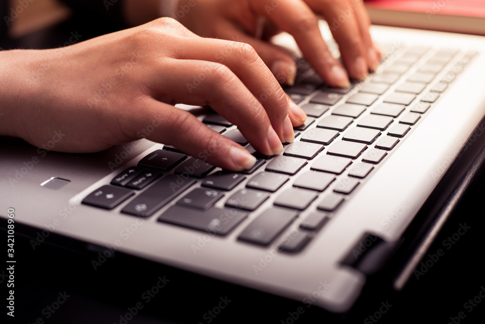 Close up photography of female hands typing on the laptop keyboard. Concept teleworking at home. Close up photography of female hands typing on the laptop keyboard. Concept teleworking at home.