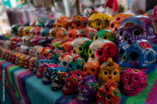 Colorful Mexican skulls for day of the dead. Cancun souvenir market has a wide array of talavera skulls, aka catrinas for Mexican Halloween