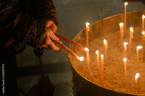 Lightening up candles in jerusalem church