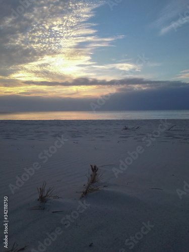 Poland Baltic Sea. View of the beach in the setting sun. Sunset.