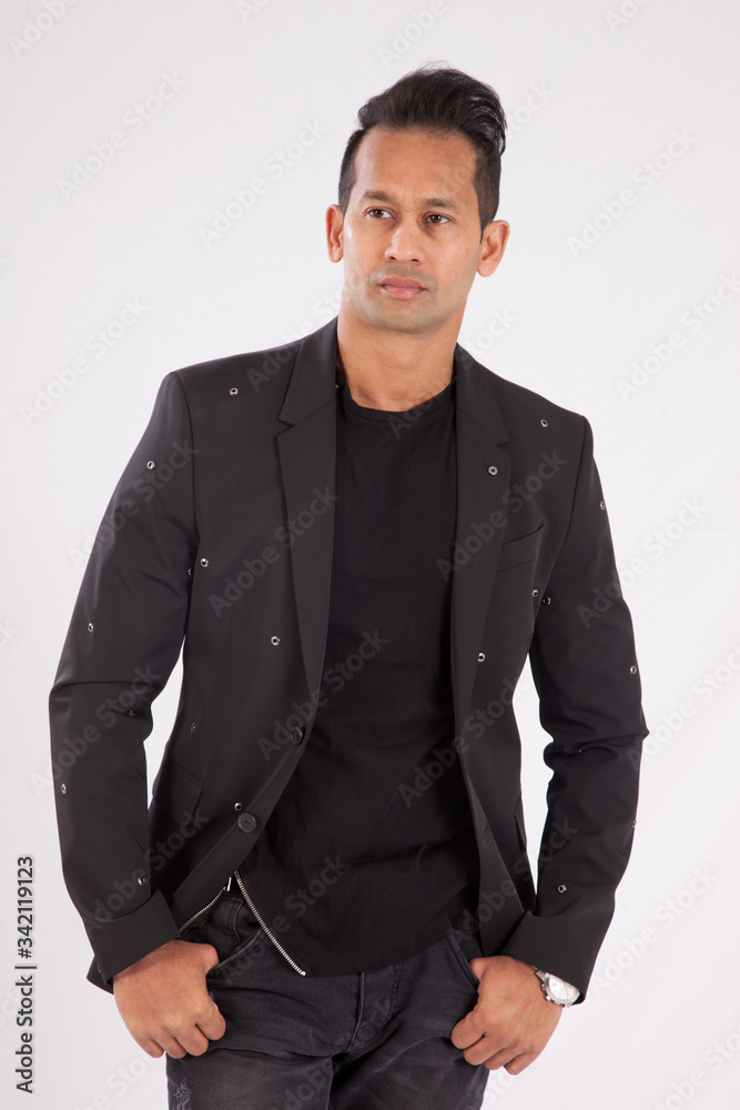 Handsome man in black shirt and jacket looking thoughtful Handsome man in black shirt and jacket looking thoughtful