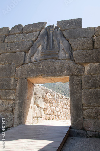 The Lion Gate -  two lionesses or lions flank central column  in Mycenae, Greece photo