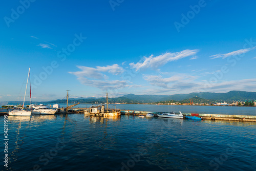 Beautiful sunset and small ships in Batumi sea port