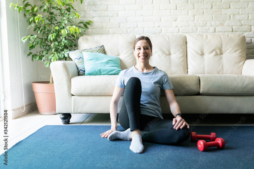 Happy woman exercising at home Happy woman exercising at home