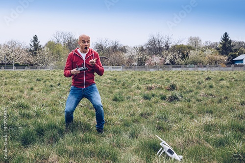 Shocked worried man after losing control of his drone.