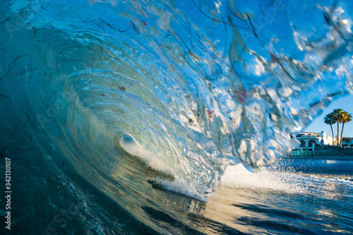 Photography A wave breaks on a reef in a tropical paradise beach