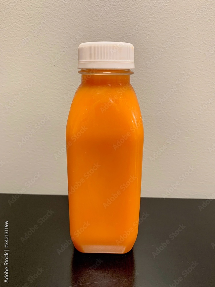 Natural juice made with carrots, orange, and ginger for an improved diet, health, and immunity Natural juice made with carrots, orange, and ginger for an improved diet, health, and immunity