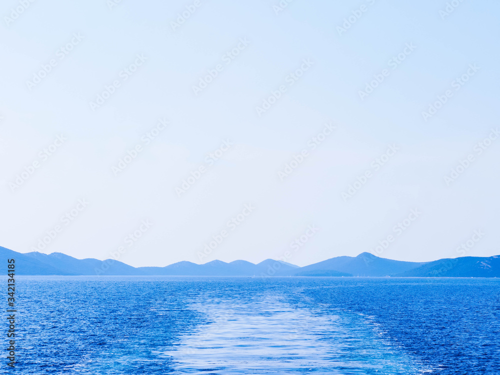deep blue sea and mountains