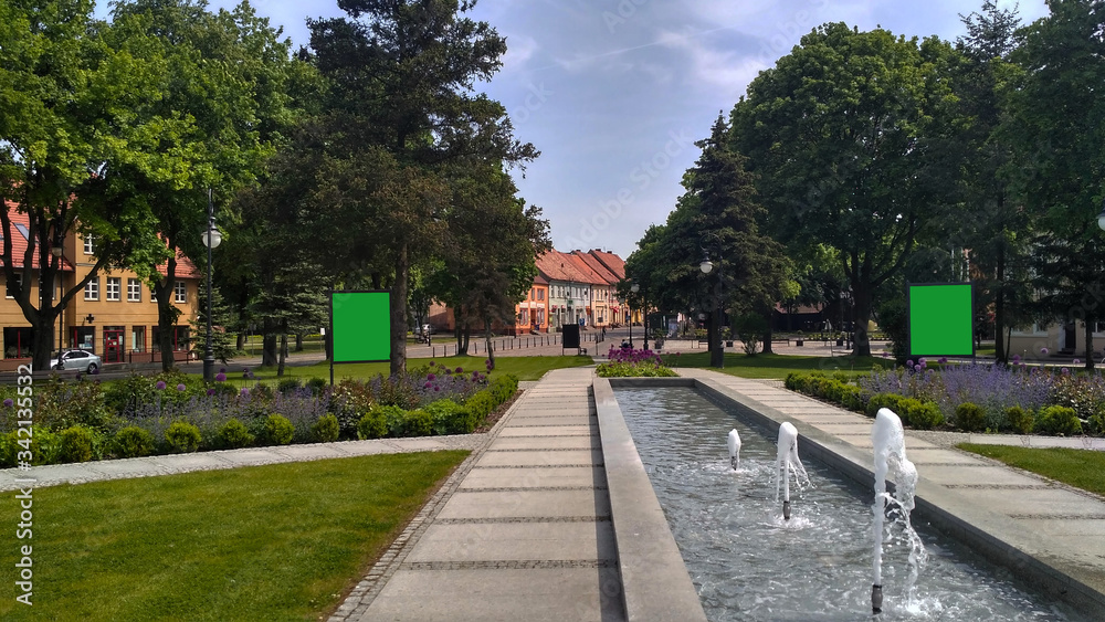 the park in the city with green billboard chromakey