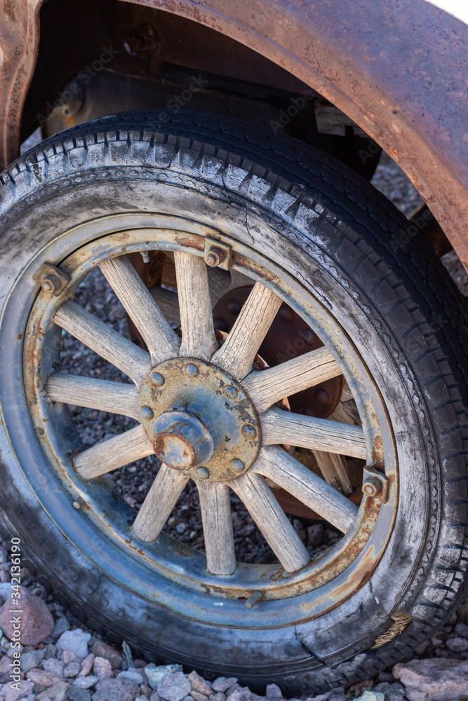 Close up of vintage car tire with wooden spokes