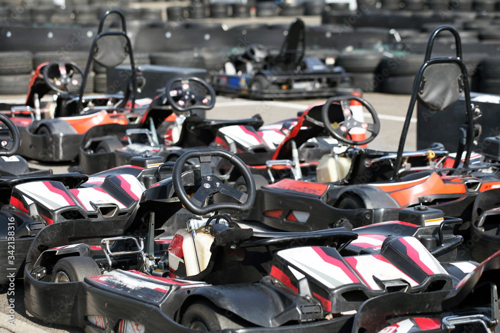 Kart cars parked next to track in anticipation of drivers