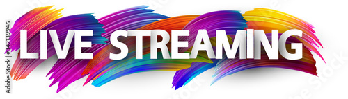 Big live streaming sign over brush strokes background.