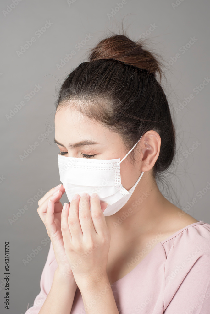 close up woman face is wearing surgical mask close up woman face is wearing surgical mask