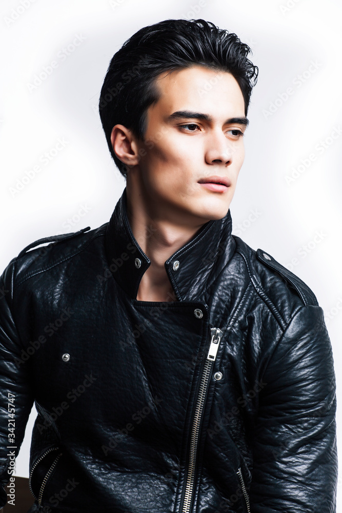 young handsome man, leather jacked on naked torso, emotional posing, white background, modern guy, lifestyle people concept young handsome man, leather jacked on naked torso, emotional posing, white background, modern guy, lifestyle people concept