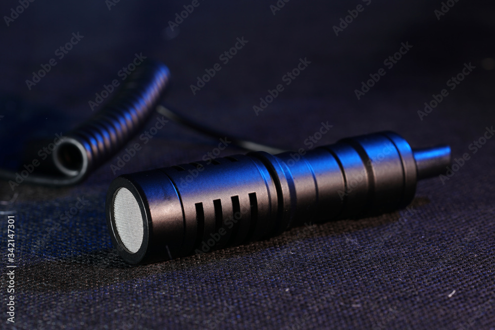 Modern microphone against dark background
Modern microphone against dark background