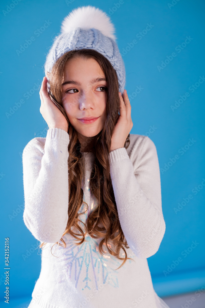 portrait of a beautiful fashionable girl in a winter hat from cold and snow portrait of a beautiful fashionable girl in a winter hat from cold and snow