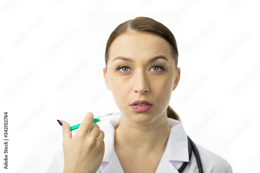 Close up portrait of beautiful cosmetologist making botox injections in underlip, isolated on white background. Aesthetic cosmetology, facial injections, lip augmentation in beauty clinic Close up portrait of beautiful cosmetologist making botox injections in underlip, isolated on white background. Aesthetic cosmetology, facial injections, lip augmentation in beauty clinic