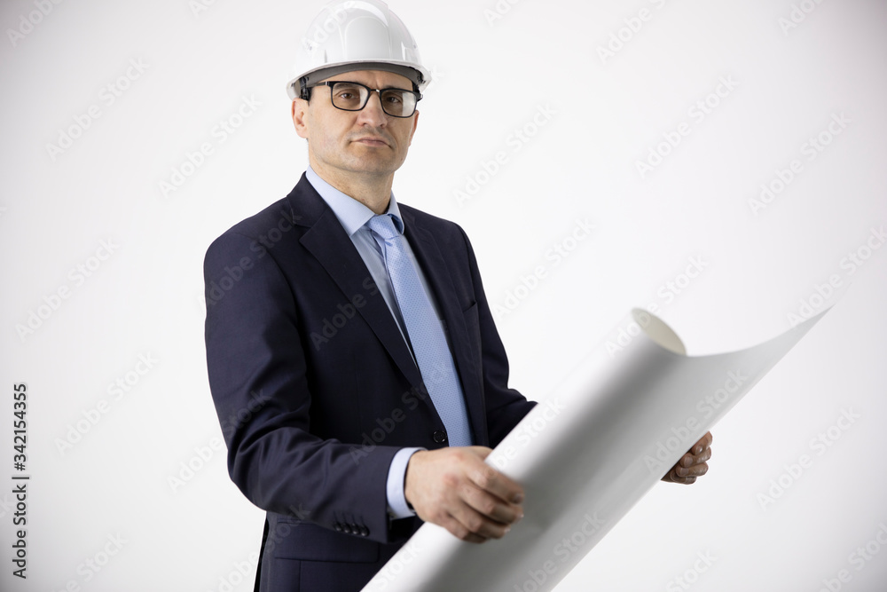 confident and calm handsome engineer oilman wearing white helmet holds drawing looks at camera isolated on white background . confident and calm handsome engineer oilman wearing white helmet holds drawing looks at camera isolated on white background .