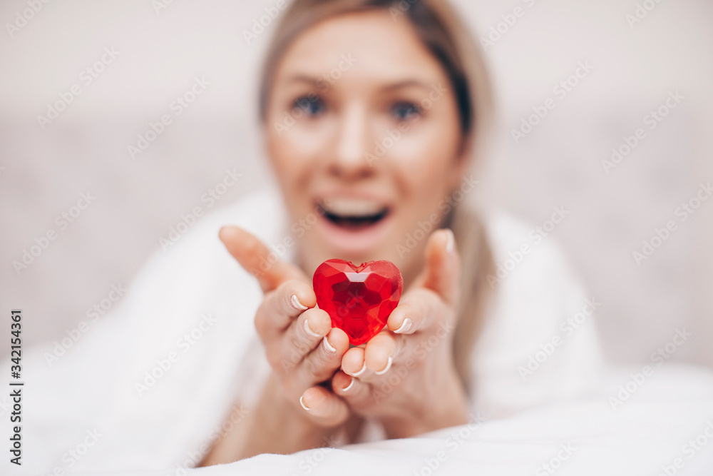 woman in bed with red heart. Red heart. Bedroom. Love photo. Background. woman in bed with red heart. Red heart. Bedroom. Love photo. Background.