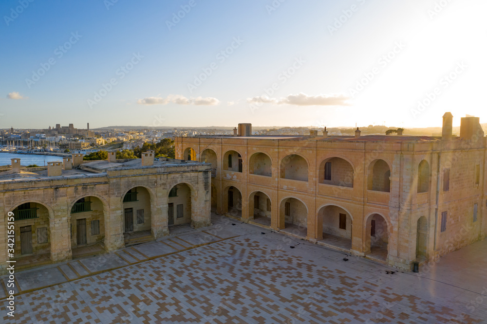 Aerial view of Fort Manoel building inside view. It was built in the 18th century by the Order of Saint John. Sunset blue sky. Gzira city. Malta country