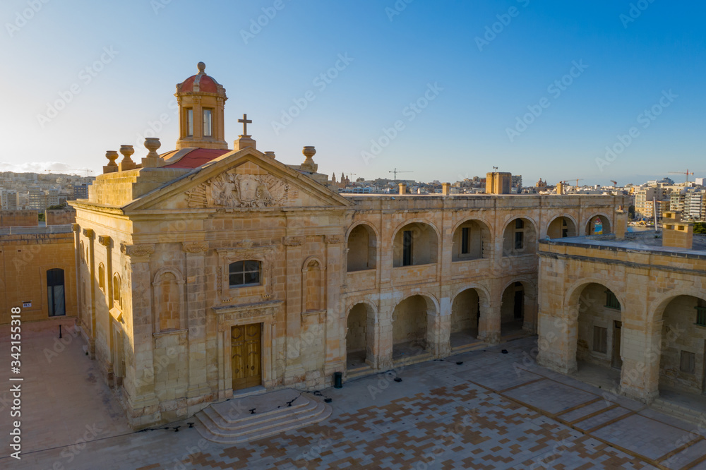Aerial view of Fort Manoel building inside view. Church. Sunset blue sky. Gzira city. Malta island